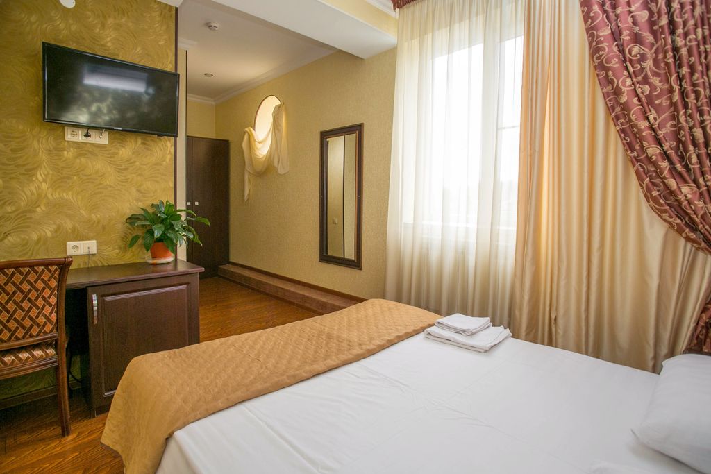 Семейный номер с 2 раздельными или 1 двухспальной кроватью