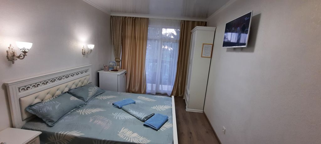 Трёхместный номер де-люкс