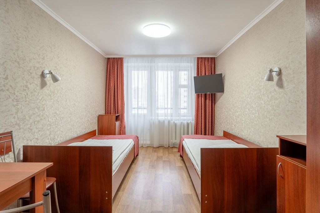 Двухместный номер с 2 отдельными кроватями эконом с общей ванной комнатой