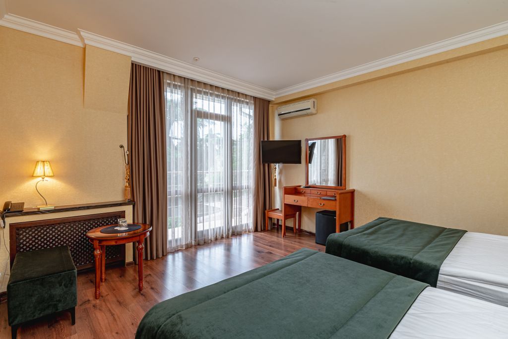 Двухместный номер с 2 отдельными кроватями стандарт улучшенный