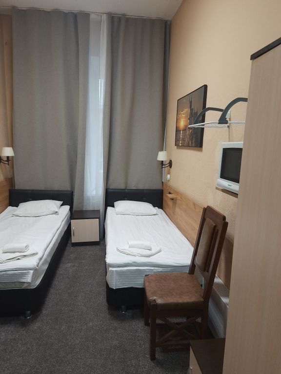 Двухместный номер с 2 отдельными кроватями стандарт увеличенной площади с санузлом