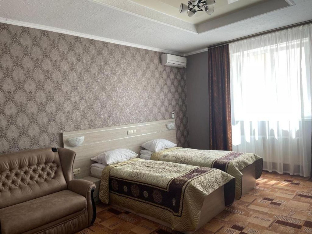 Двухместный номер с 2 отдельными кроватями стандарт улучшенный