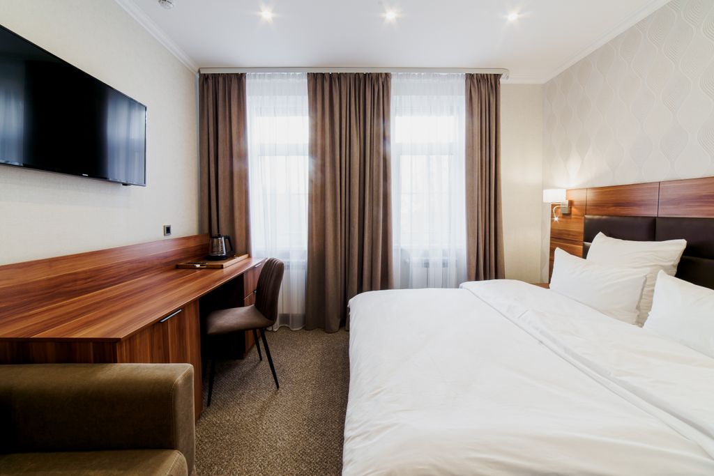 Четырёхместный номер делюкс с кроватью размера king-size