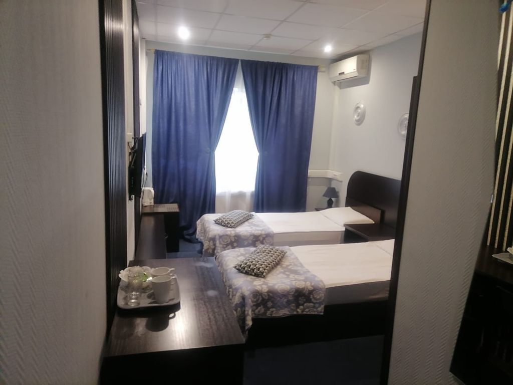 Двухместный номер с 2 отдельными кроватями и ванной комнатой