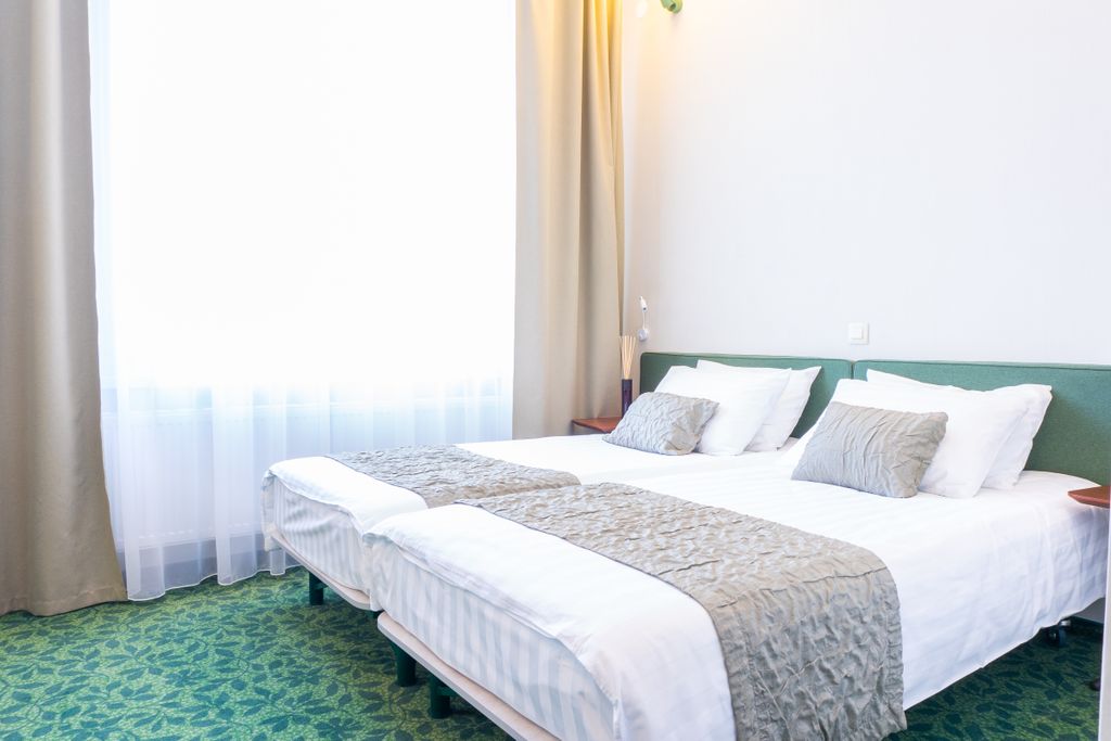 Двухместный номер с 2 отдельными кроватями стандартный с 1 большой или 2 раздельными кроватями