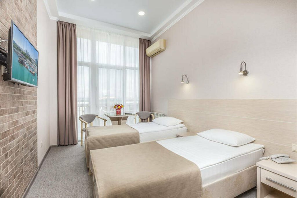 Двухместный номер с 2 отдельными кроватями студио-стандарт 1 этаж