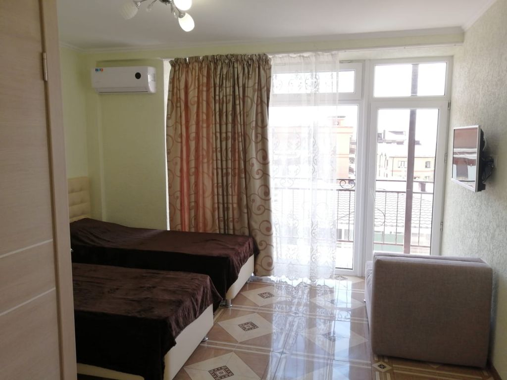 Двухместный номер с 2 отдельными кроватями и дополнительным местом