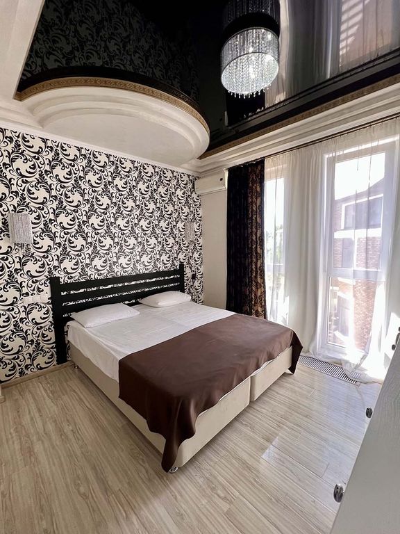 Трёхместный номер делюкс жемчужный