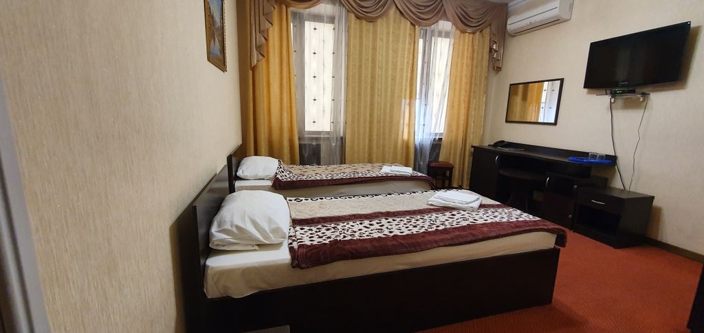 Двухместный номер с 2 отдельными кроватями стандарт улучшенный