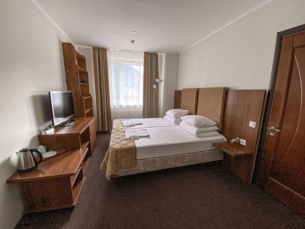 Двухместный номер с 2 отдельными кроватями стандарт (с доп. местом)