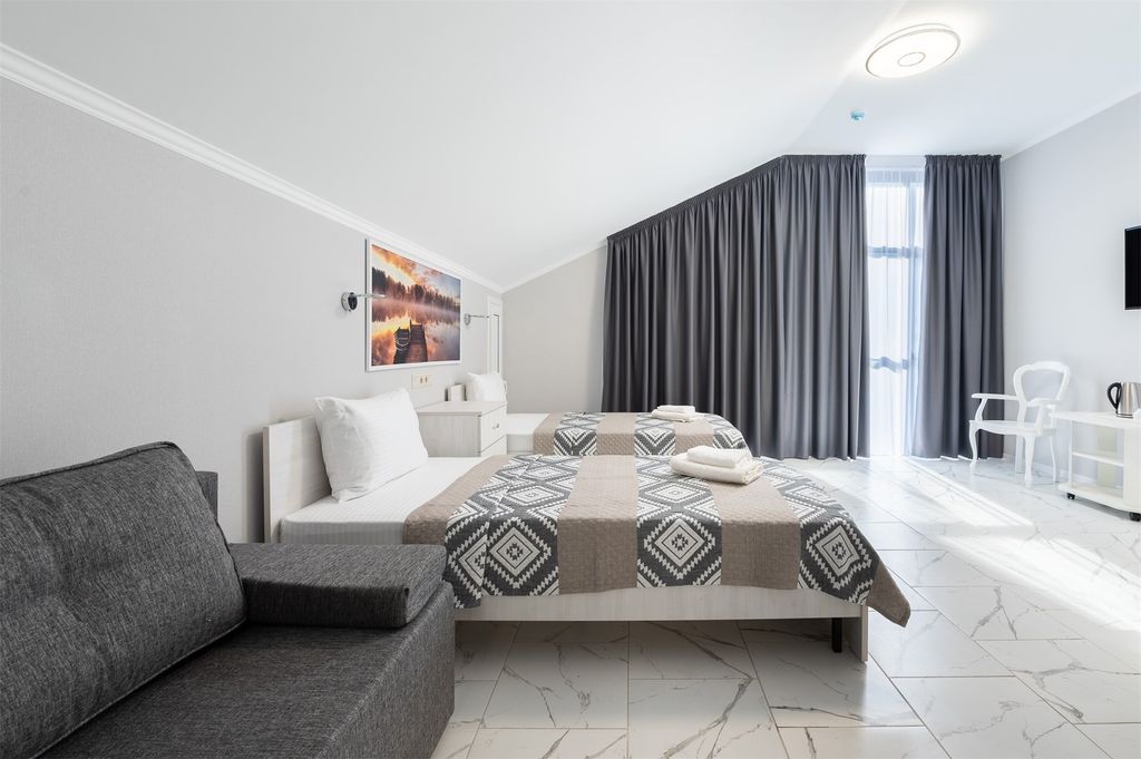 Четырёхместный номер Делюкс