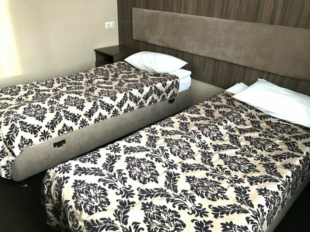 Двухместный номер с 2 отдельными кроватями улучшенный стандарт