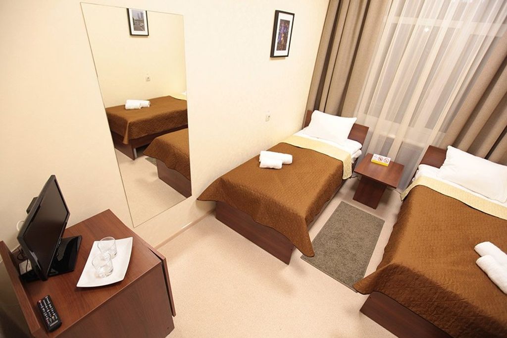 Двухместный номер с 2 отдельными кроватями Стандарт, общий сан. узел