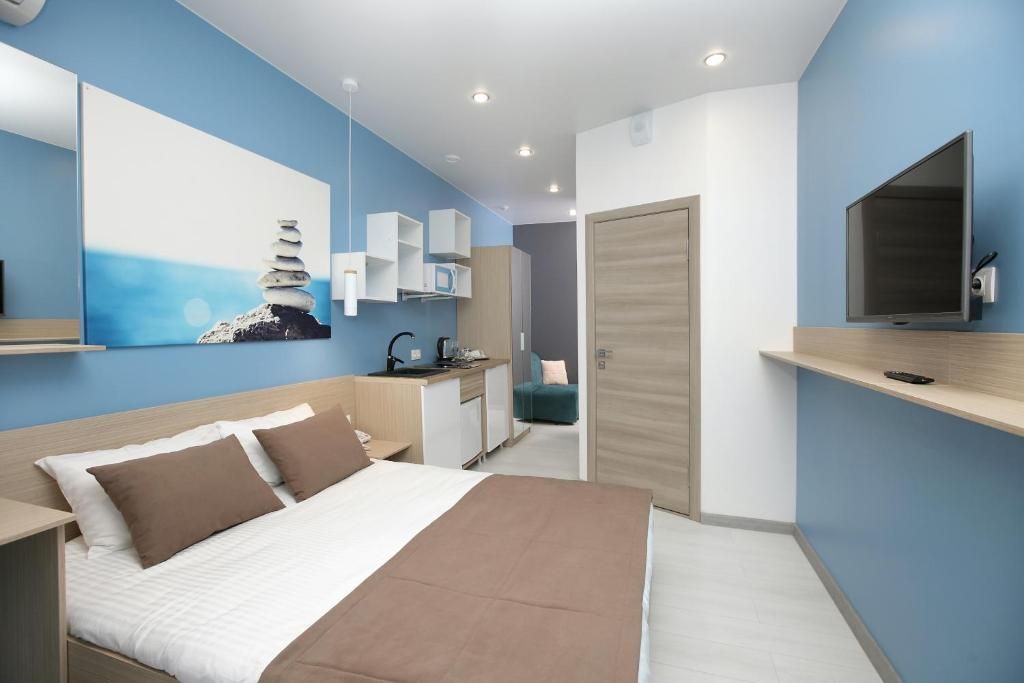 Трёхместный номер с кухней и балконом