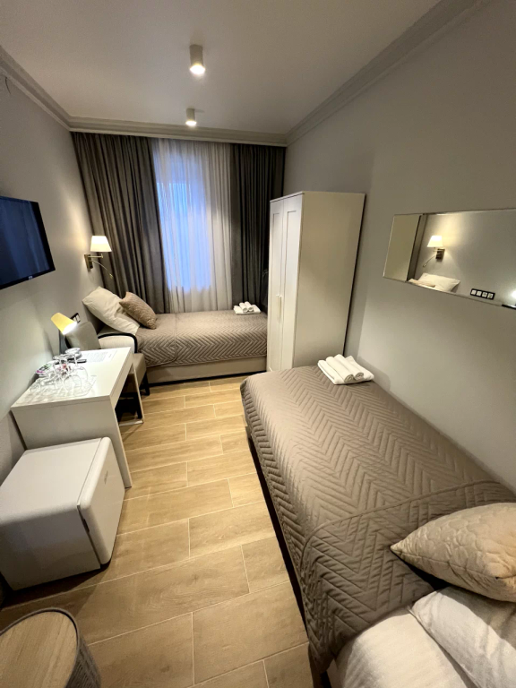 Двухместный номер с 2 отдельными кроватями средний