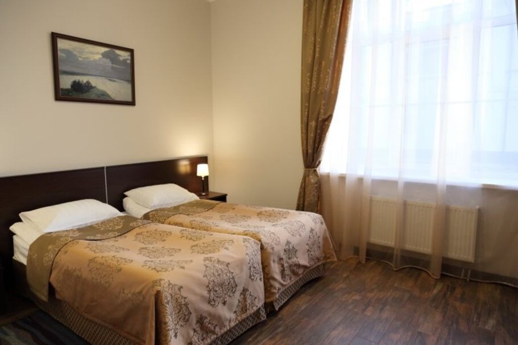 Двухместный номер с 2 отдельными кроватями или с одной большой двуспальной стандарт