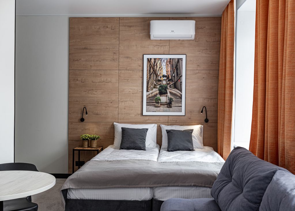 Апартаменты Студия с мини-кухней с двумя односпальными кроватями и диваном