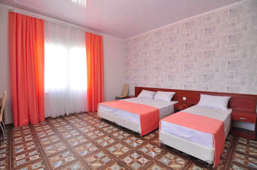 Четырёхместный номер Де Люкс