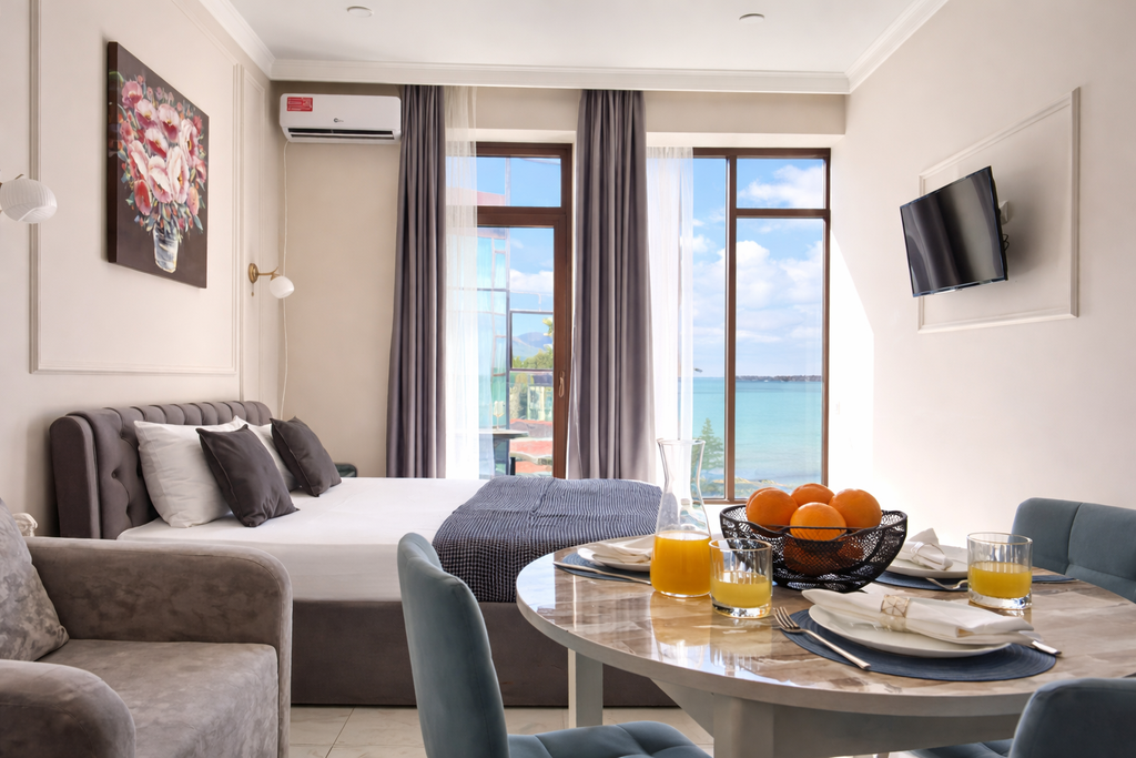 Апартаменты делюкс с видом на море и балконом