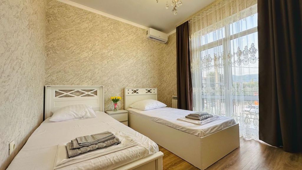 Двухместный номер с 2 отдельными кроватями с балконом и видом на горы