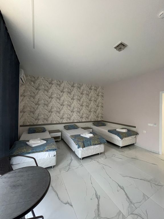 Семейный номер трехместный с раздельными кроватями