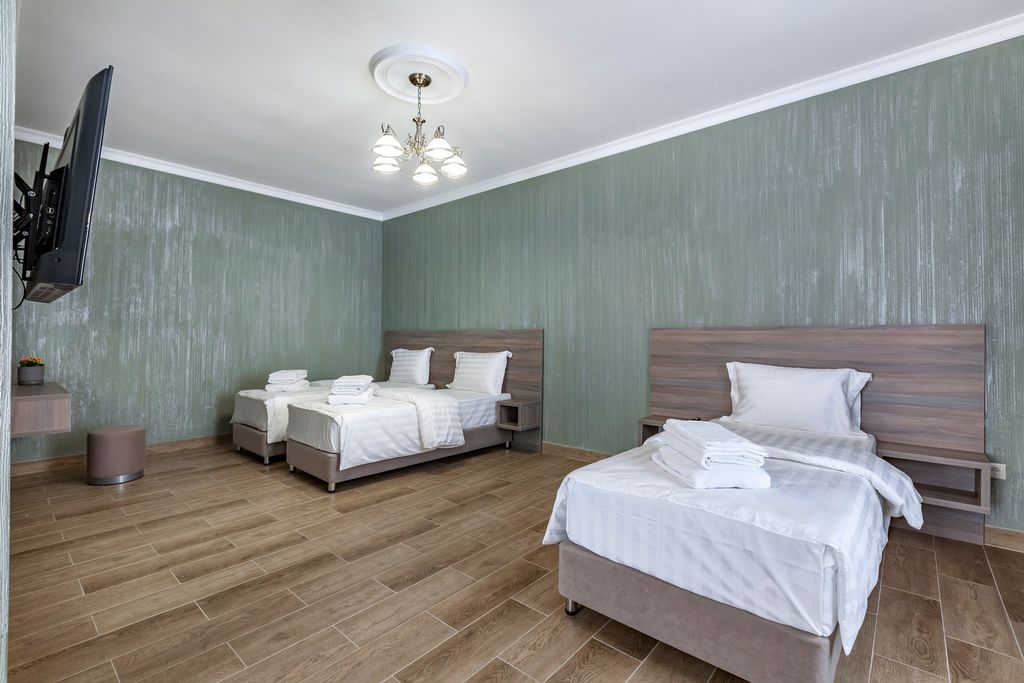 Трёхместный номер Студия улучшенная