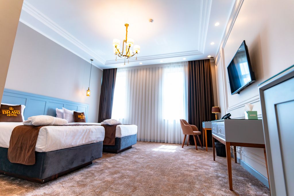 Двухместный номер с 2 отдельными кроватями или с одной двуспальной делюкс