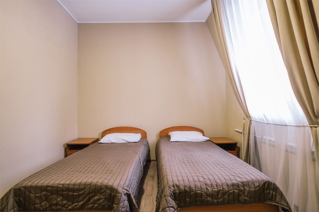 Двухместный номер с 2 отдельными кроватями в блоке