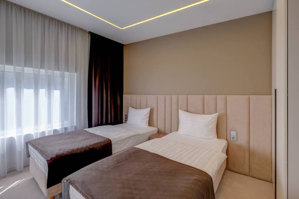 Двухместный номер с 1 кроватью стандарт с двумя раздельными или одной общей кроватью