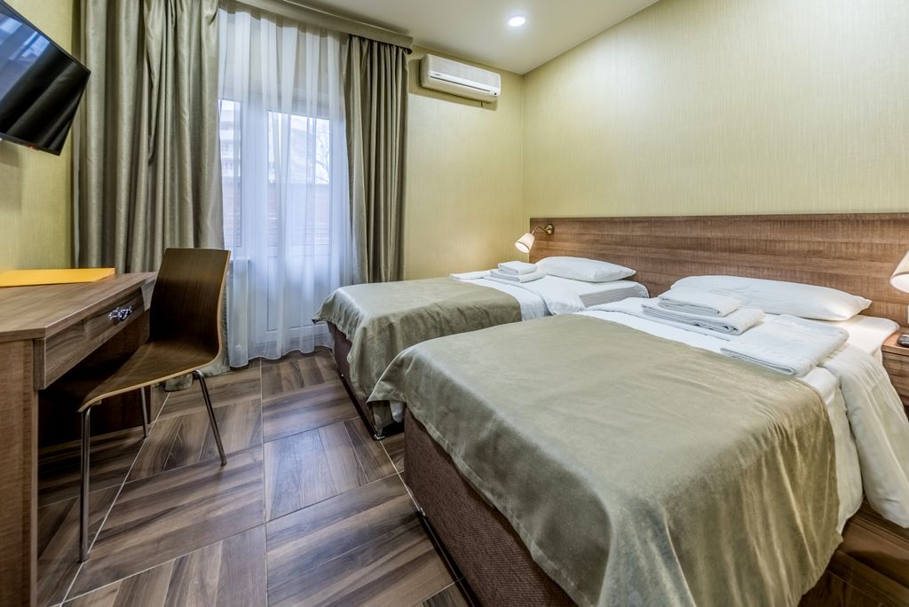 Двухместный номер с 2 отдельными кроватями улучшенный с балконом