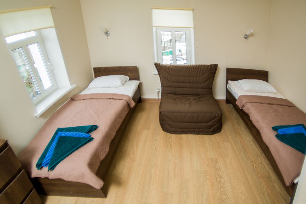 Двухместный номер с 2 отдельными кроватями и диваном