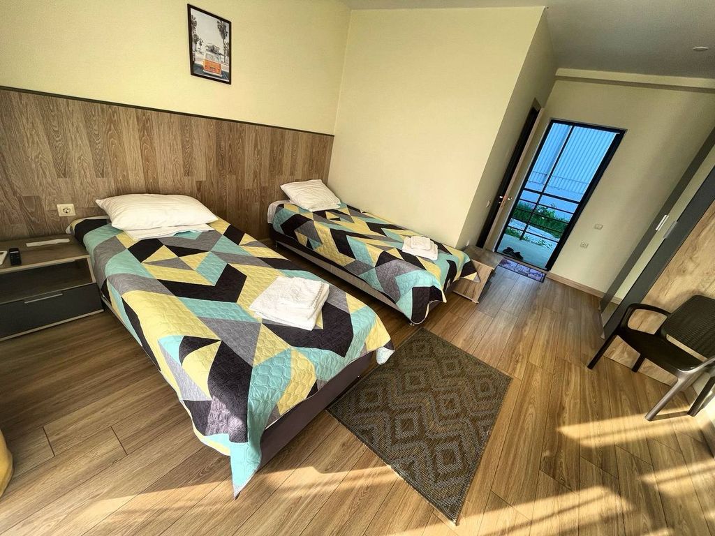 Двухместный номер с 2 отдельными кроватями улучшенный с видом на море