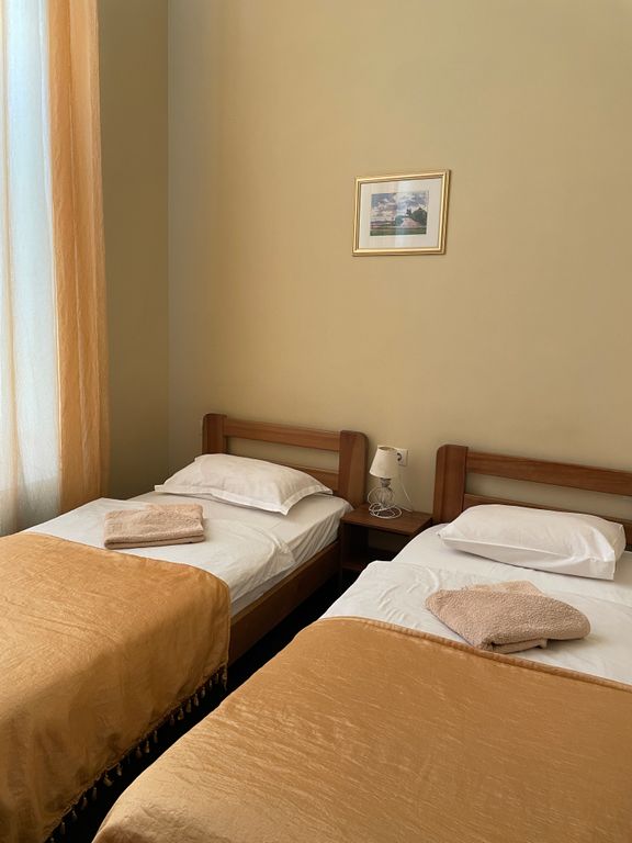 Двухместный номер с 2 отдельными кроватями улучшенный стандарт