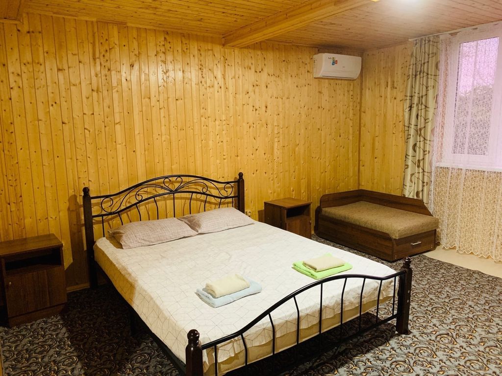 Четырёхместный номер каменный домик