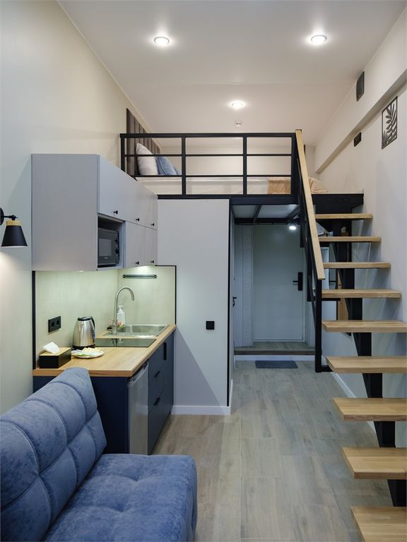 Трёхместный номер двухуровневая студия