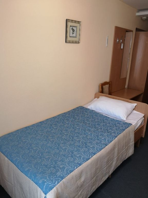 Двухместный номер с 2 отдельными кроватями стандарт улучшенный 4 этаж