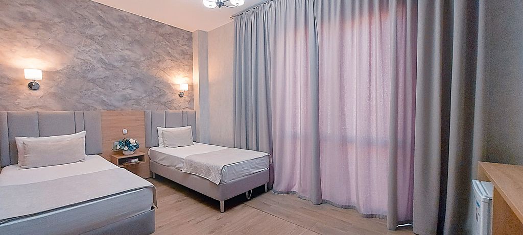 Двухместный номер с 2 отдельными кроватями улучшенный с балконом