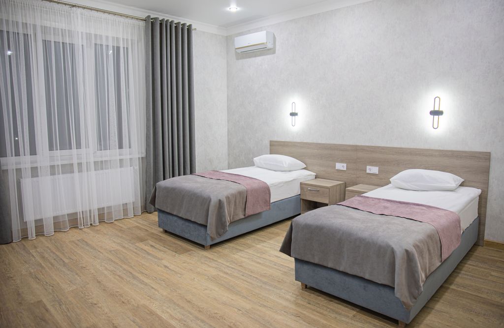 Двухместный номер с 2 отдельными кроватями Стандарт с 2-мя односпальными кроватями