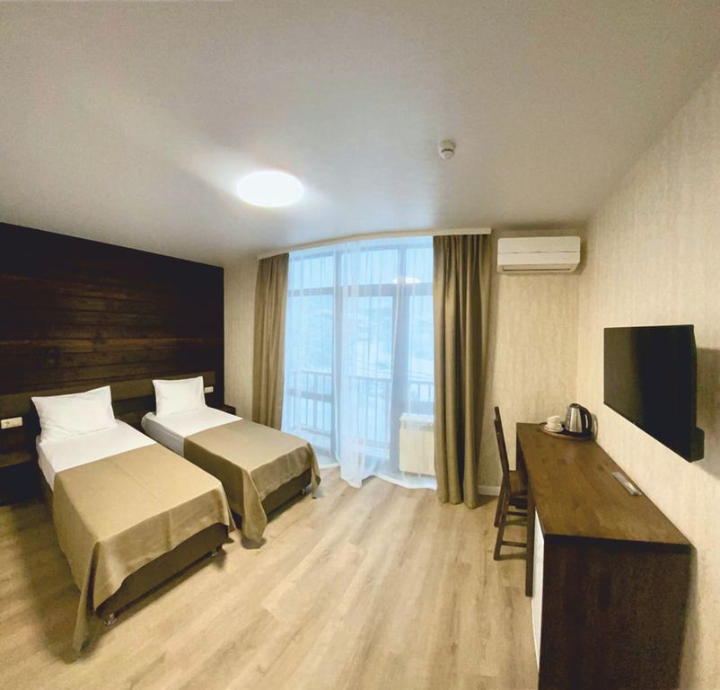 Двухместный номер с 2 отдельными кроватями Стандарт с балконом