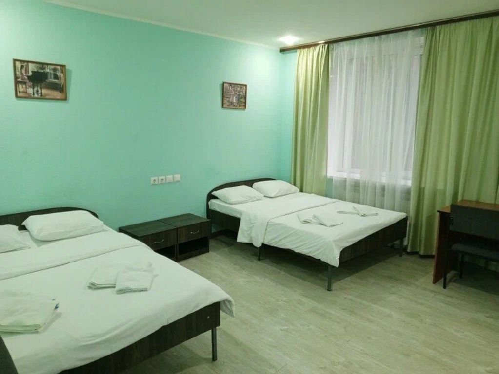 Четырёхместный номер с 2 кроватями размера Кинг сайз