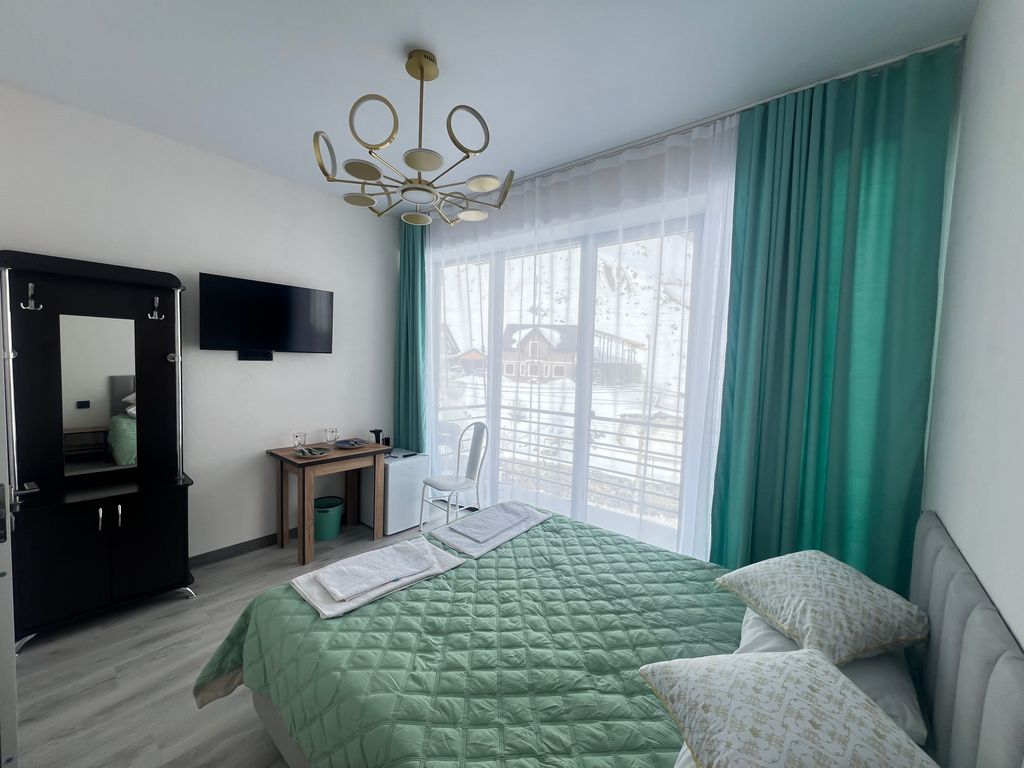 Двухместный номер с 1 кроватью новый люкс в 5 минутах от канатной дороги с видом на горы