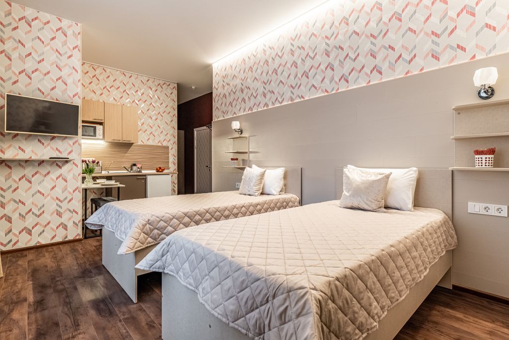 Трёхместный номер делюкс в кухней и санузлом у центре